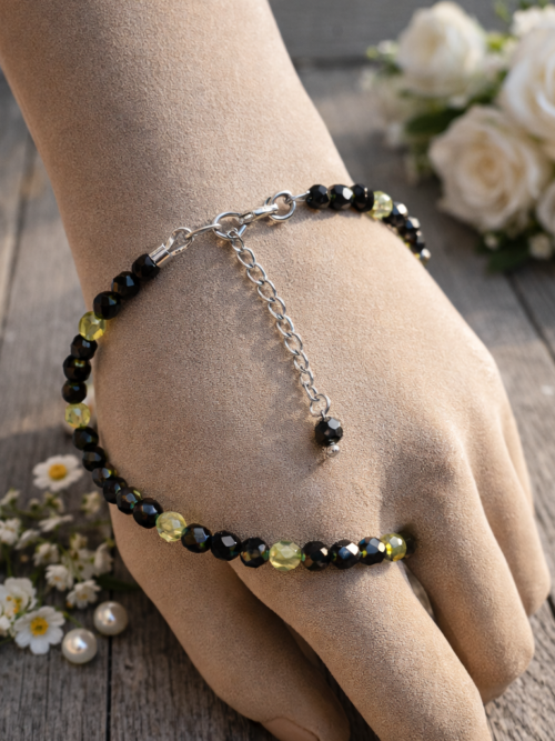 BRACELET PIERRES NATURELLESOBSIDIENNE OEIL CELESTE ARGENTE ET PERIDOT FACETTEES