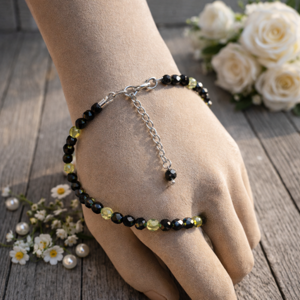 BRACELET PIERRES NATURELLESOBSIDIENNE OEIL CELESTE ARGENTE ET PERIDOT FACETTEES